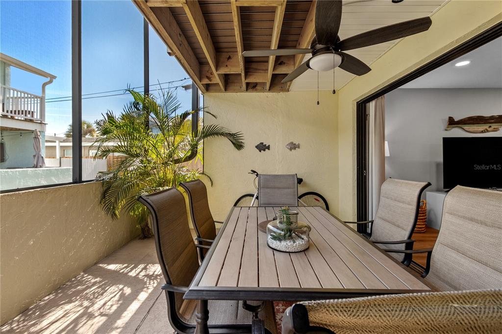 1752 Stickney Point Road, Unit 102 Sarasota, FL 34231 - Photo 44 of 50 a view of table and chair with wooden floor