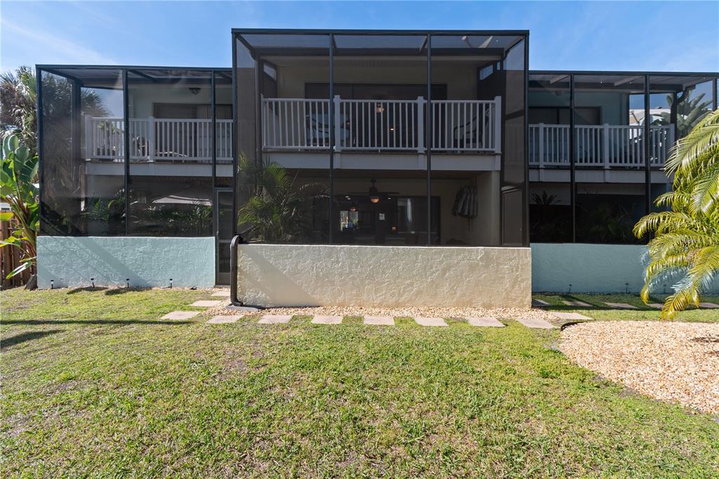 1752 Stickney Point Road, Unit 102 Sarasota, FL 34231 - Photo 46 of 50 a view of a house with backyard and sitting area