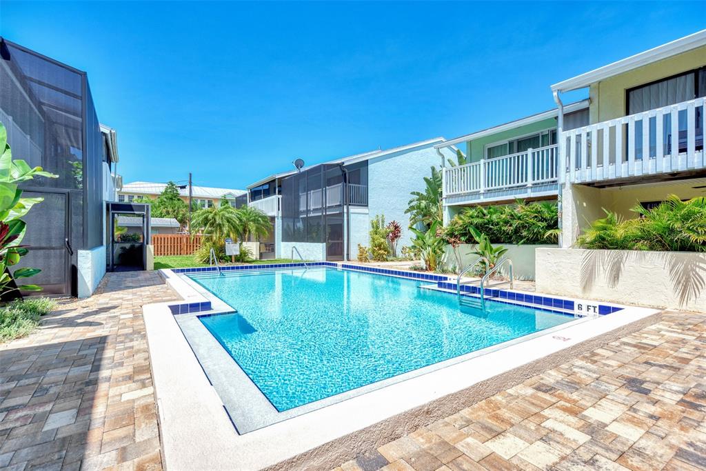 1752 Stickney Point Road, Unit 102 Sarasota, FL 34231 - Photo 47 of 50 a view of swimming pool with a patio