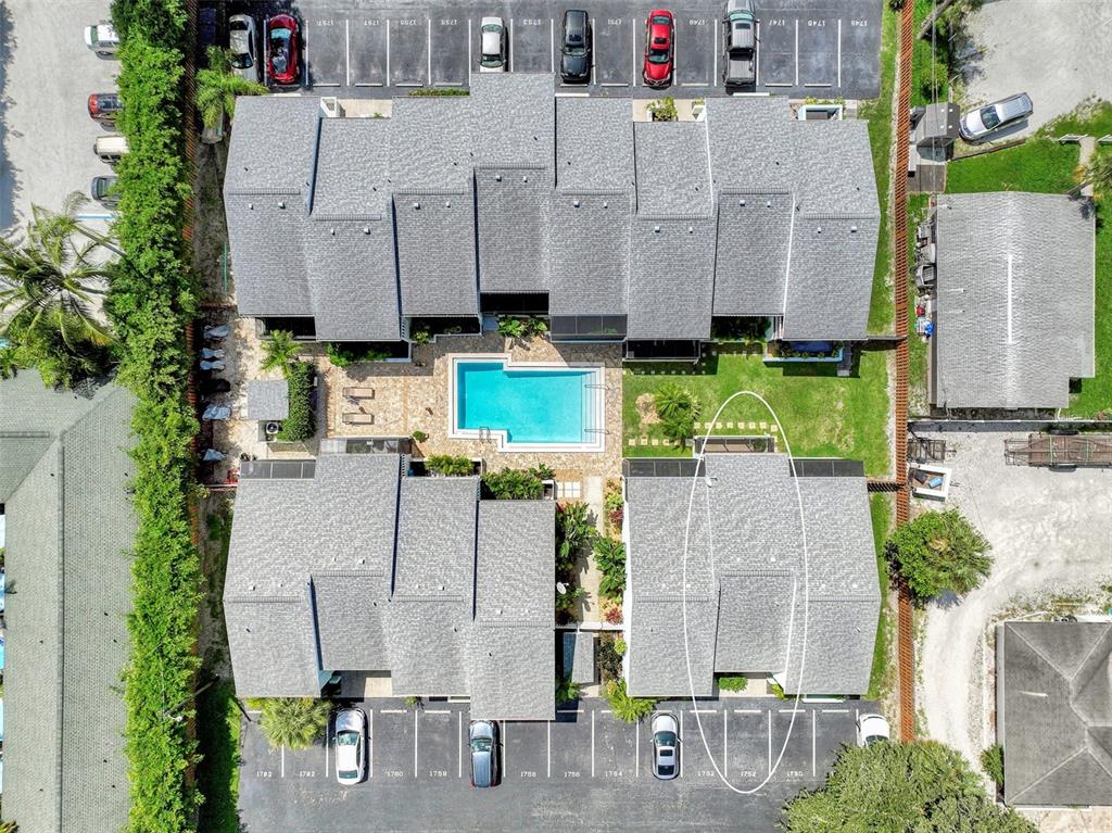1752 Stickney Point Road, Unit 102 Sarasota, FL 34231 - Photo 49 of 50 an aerial view of multiple house with outdoor space