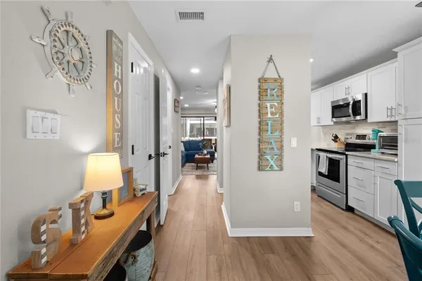 a view of kitchen with furniture and wooden floor