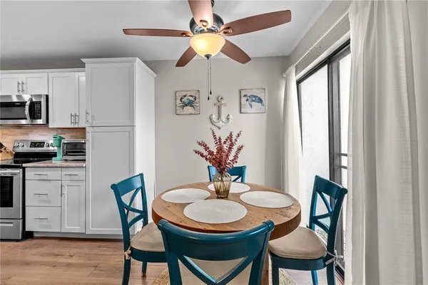 a dining room with furniture and window