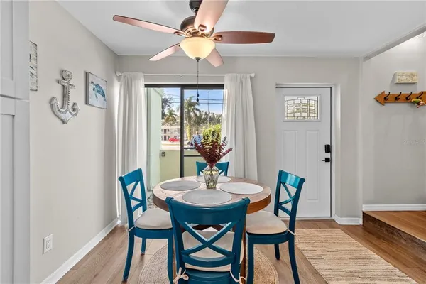a dining room with furniture and window