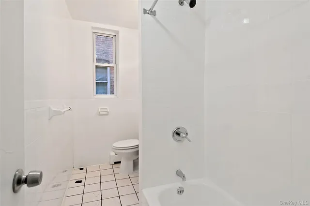 a bathroom with a bathtub sink and toilet