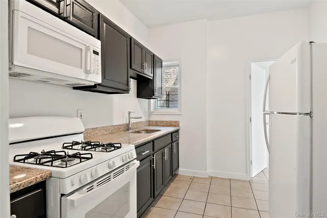 a kitchen with a stove and a microwave