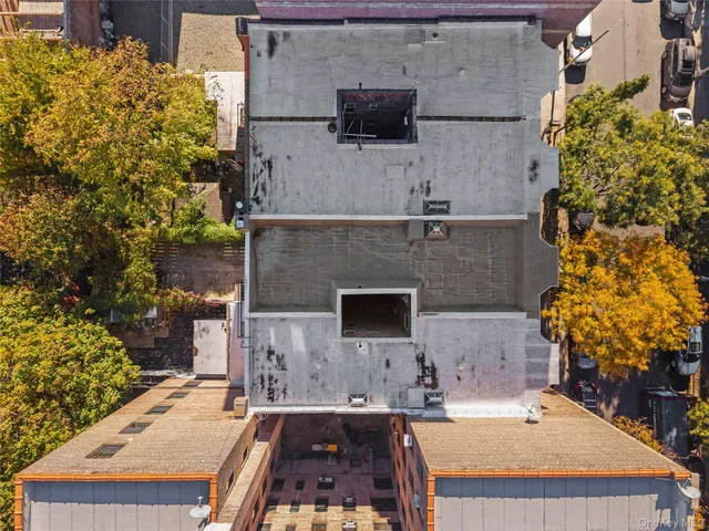 aerial view of a house with a yard