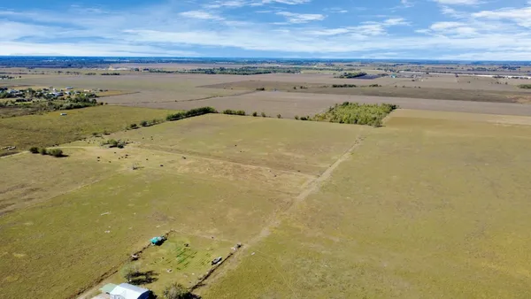 an aerial view of beach and ocean