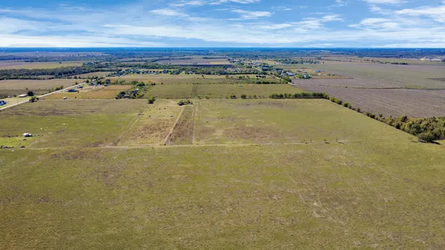 an aerial view of beach and ocean