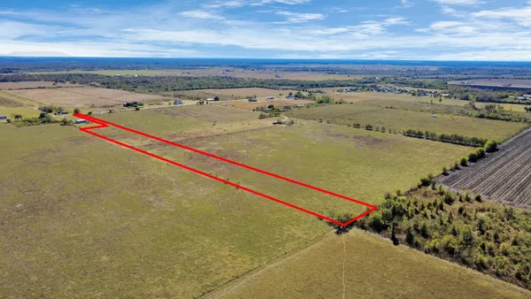 an aerial view of beach and ocean