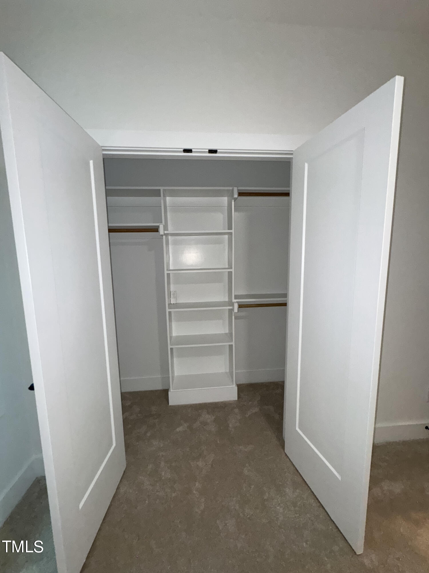 1101 South Chavis Road Kittrell, NC 27544 - Photo 13 of 20 a view of walk in closet with empty racks