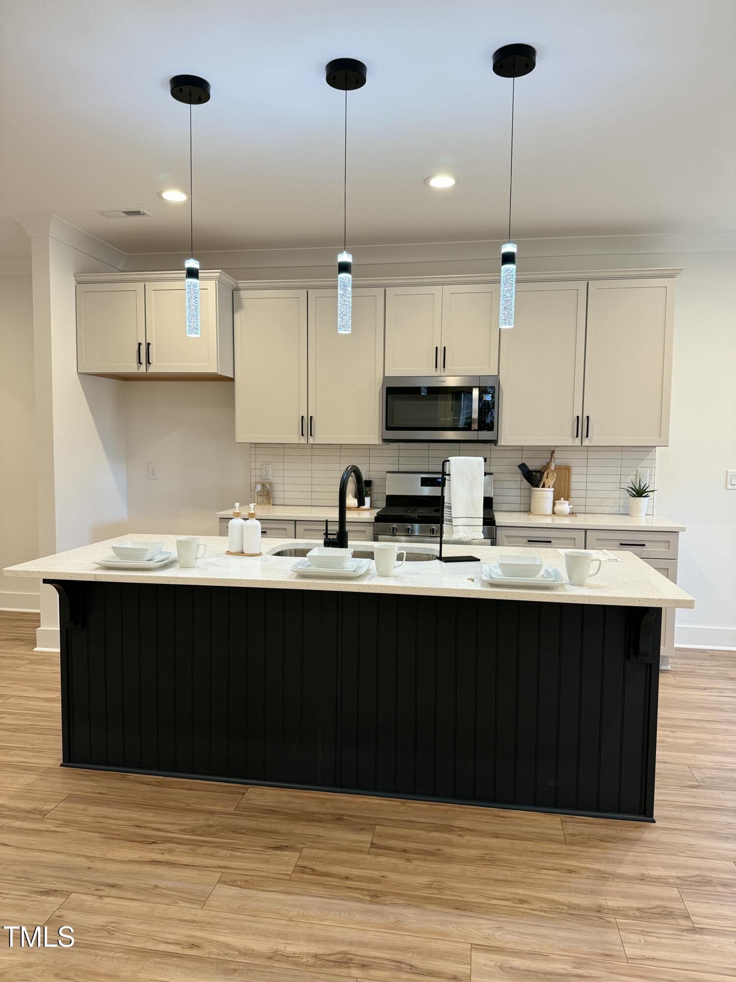 1101 South Chavis Road Kittrell, NC 27544 - Photo 2 of 20 a kitchen with stainless steel appliances granite countertop a sink a stove and a refrigerator