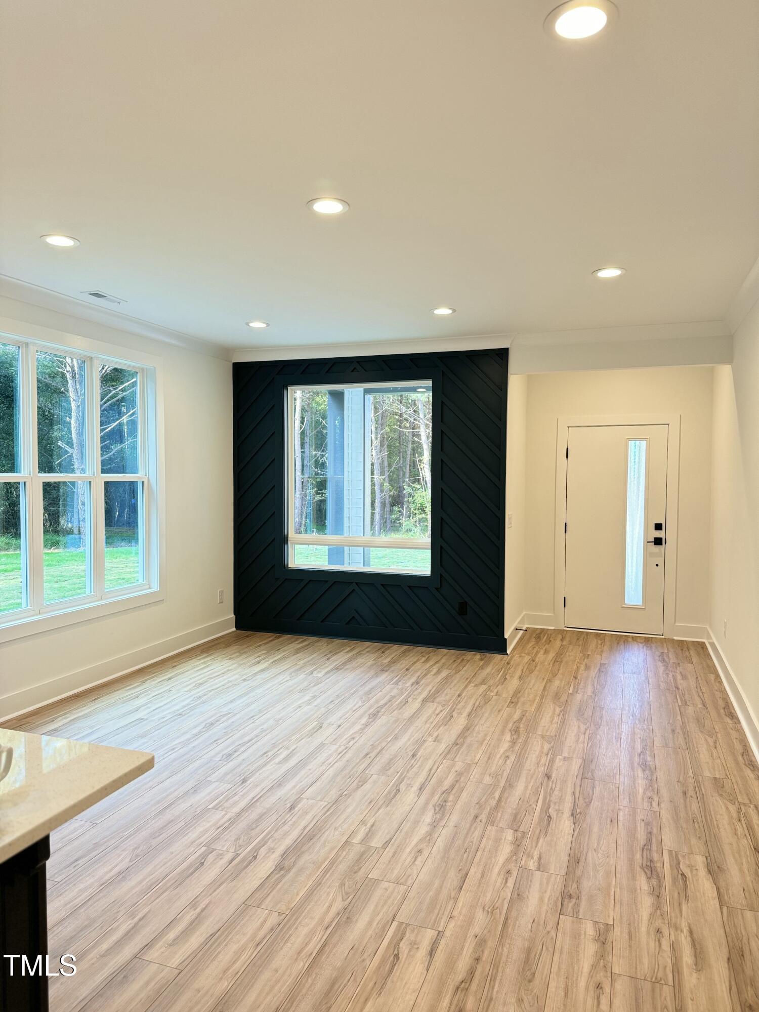 1101 South Chavis Road Kittrell, NC 27544 - Photo 5 of 20 wooden floor in an empty room with a window