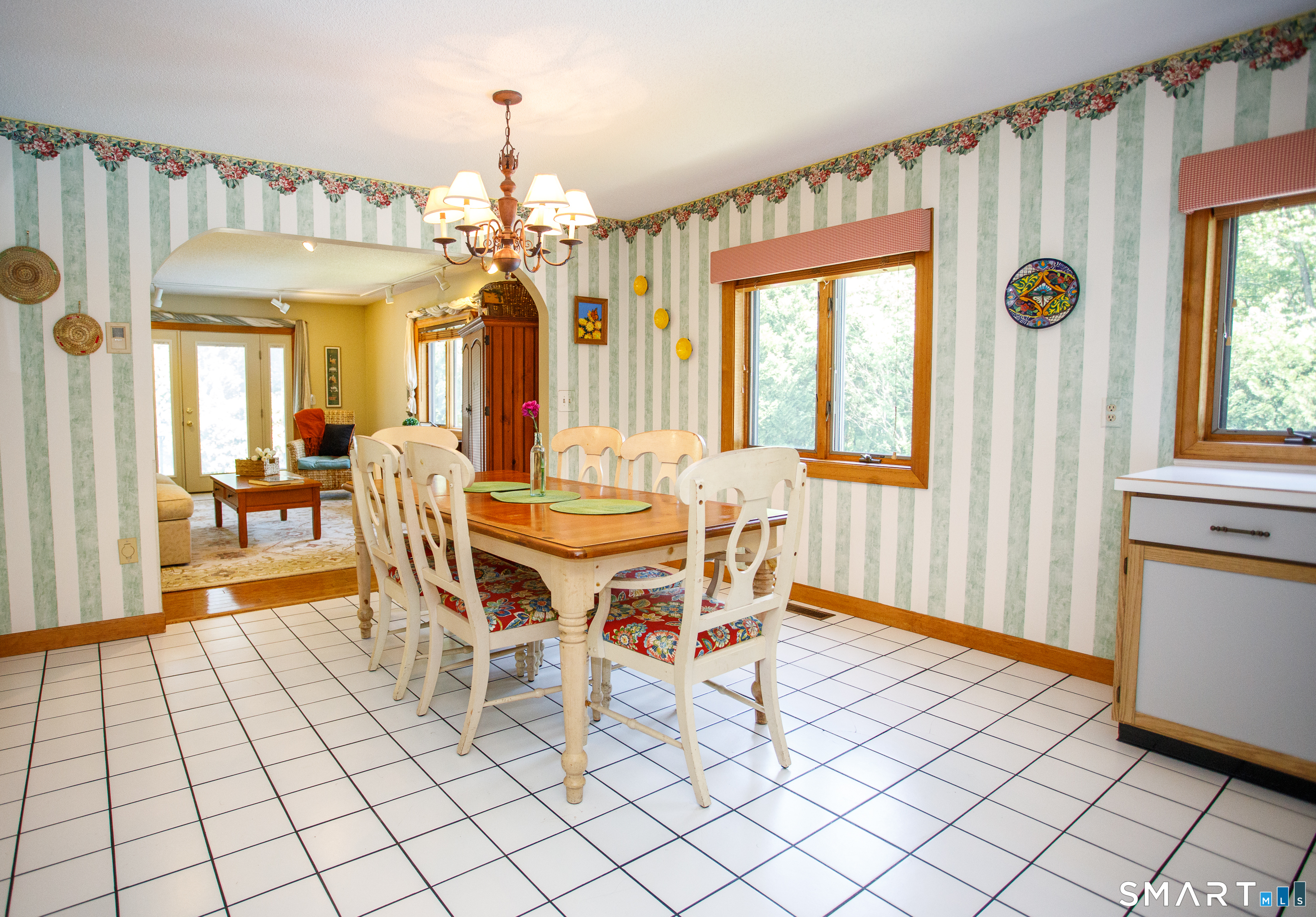 25 Stony Ridge Road Norwich, CT 06360 - Photo 7 of 40 a dining room with furniture a chandelier and wooden floor