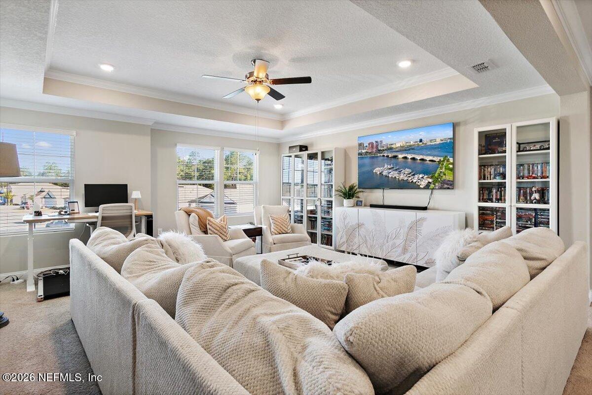 15 Zancara Street St. Augustine, FL 32084 - Photo 17 of 46 a living room with furniture large window and flat screen tv