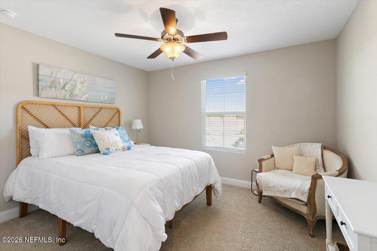 15 Zancara Street St. Augustine, FL 32084 - Photo 22 of 46 a bedroom with a bed and window