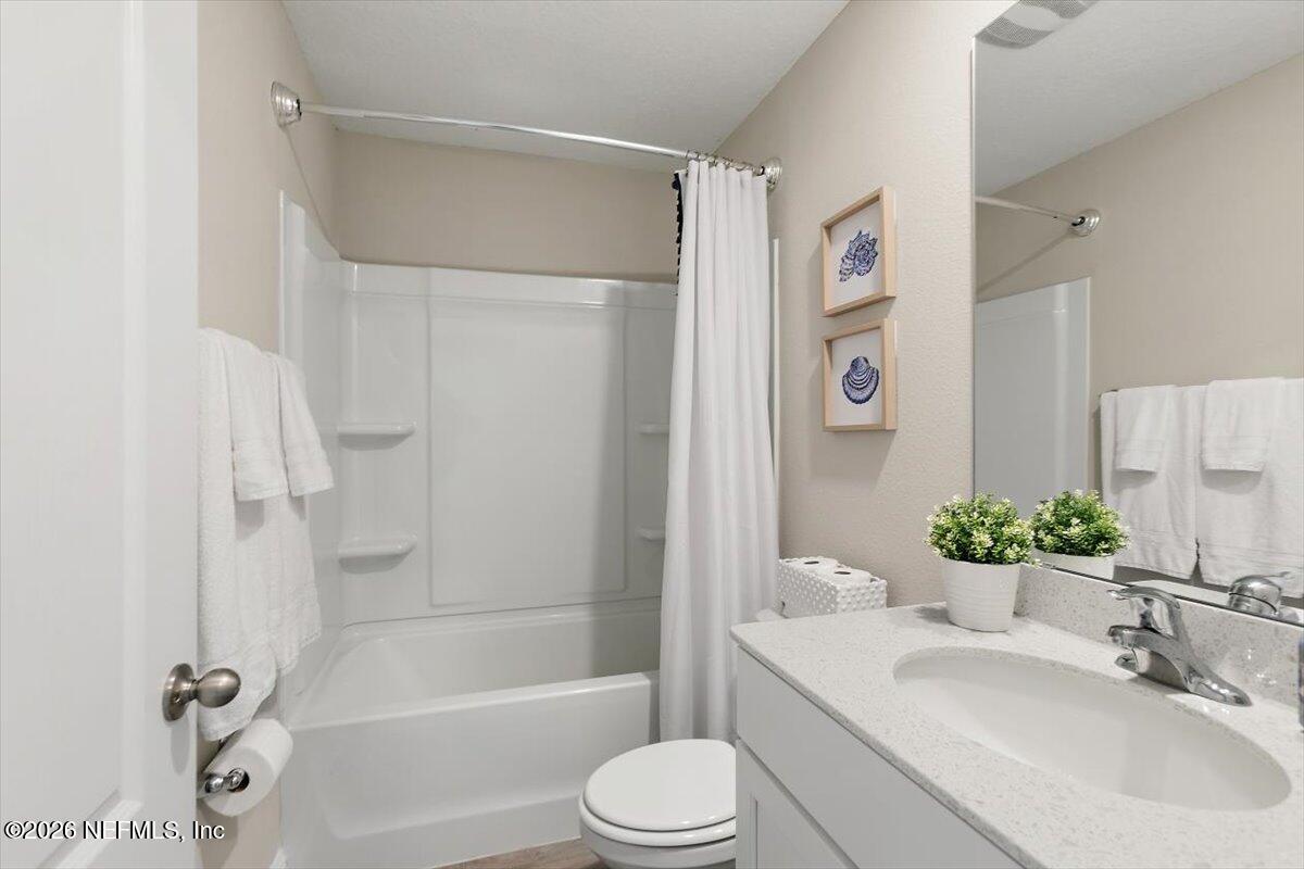 15 Zancara Street St. Augustine, FL 32084 - Photo 25 of 46 a bathroom with a sink toilet and shower