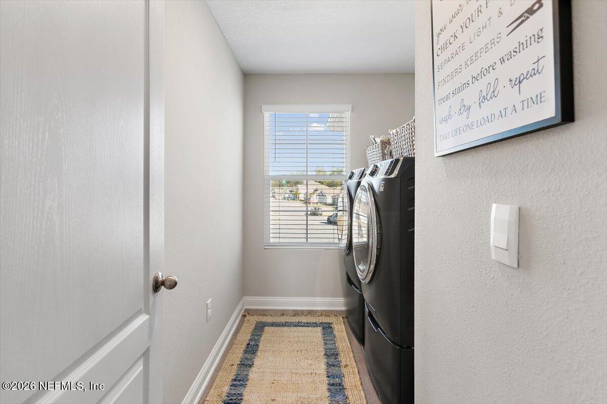 15 Zancara Street St. Augustine, FL 32084 - Photo 26 of 46 a bathroom with a granite countertop shower and a window