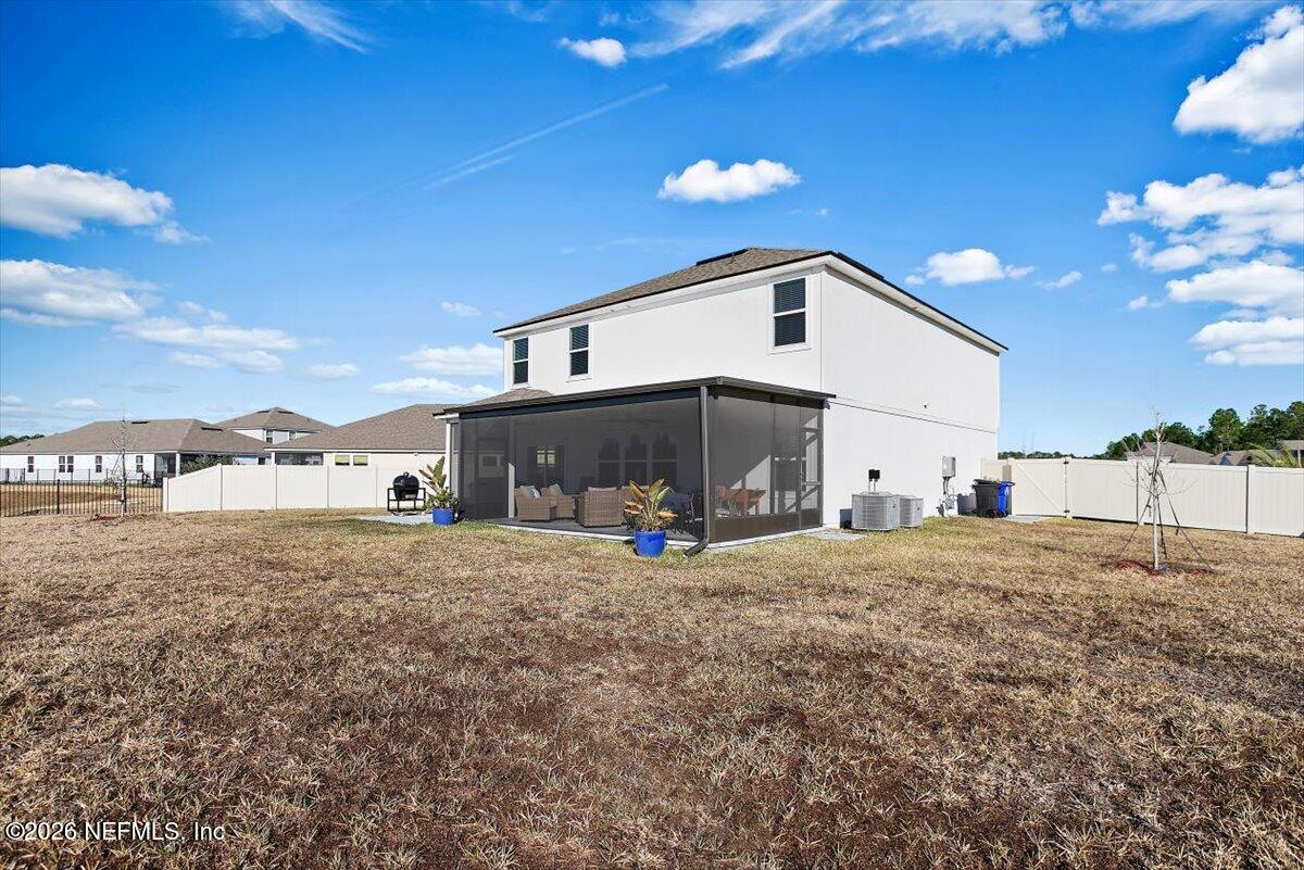 15 Zancara Street St. Augustine, FL 32084 - Photo 28 of 46 a view of a house with a yard