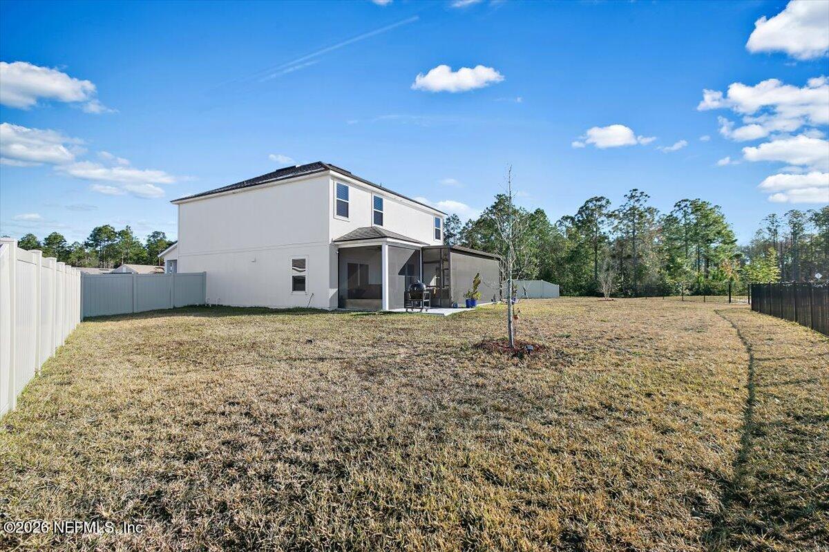 15 Zancara Street St. Augustine, FL 32084 - Photo 30 of 46 a house view with a backyard