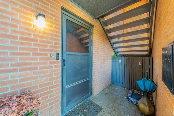 a view of a door and chair in the room