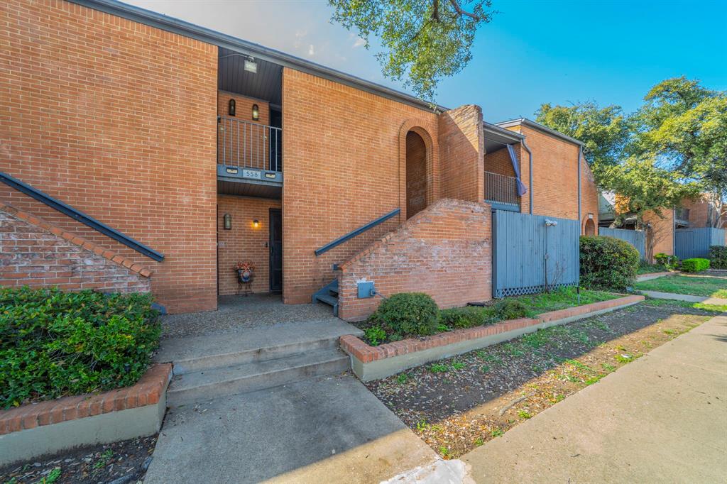 558 E Avenue, Unit B Grand Prairie, TX 75050 - Photo 13 of 16 a front view of a house with garden