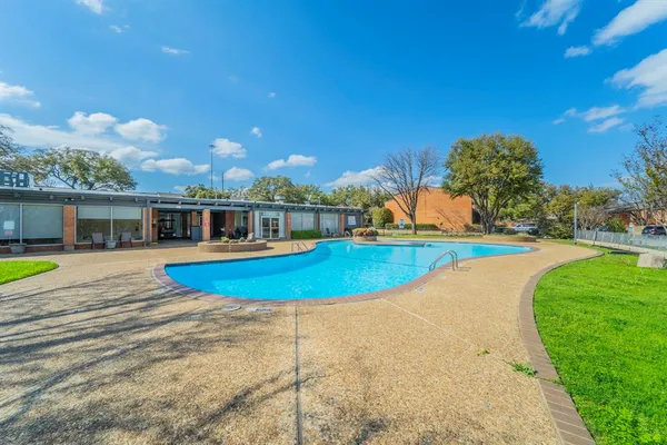 a view of a house with swimming pool and yard