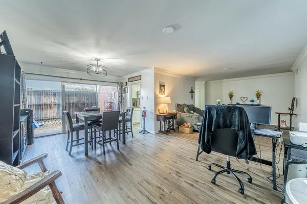 a view of a livingroom with furniture and wooden floor