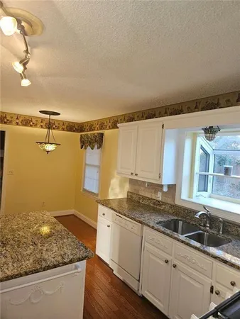 a kitchen with a sink and cabinets