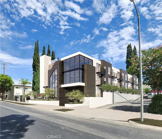 a view of a street with a building in the background