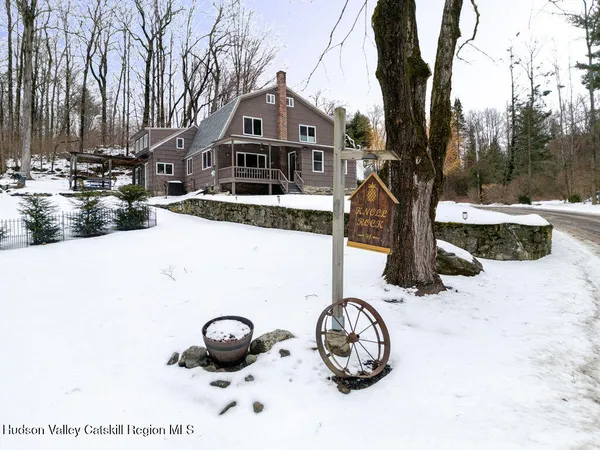 a front view of a house with parking space
