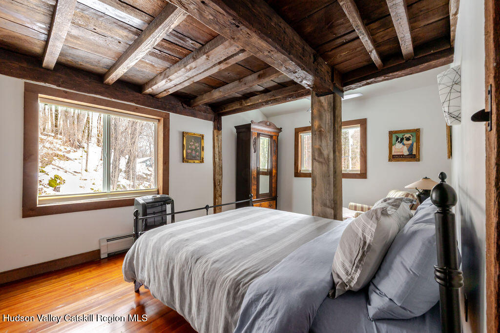 91 Miller Road Canaan, NY 12029 - Photo 21 of 29 a bed sitting in a bedroom next to a window