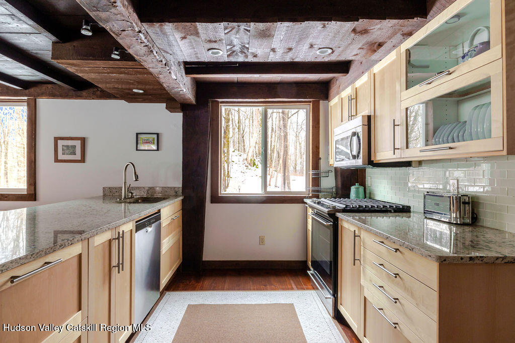 91 Miller Road Canaan, NY 12029 - Photo 7 of 29 a kitchen with stainless steel appliances granite countertop a sink stove and cabinets