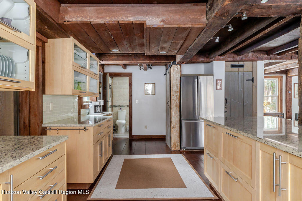 91 Miller Road Canaan, NY 12029 - Photo 8 of 29 a view of a kitchen with a sink and refrigerator