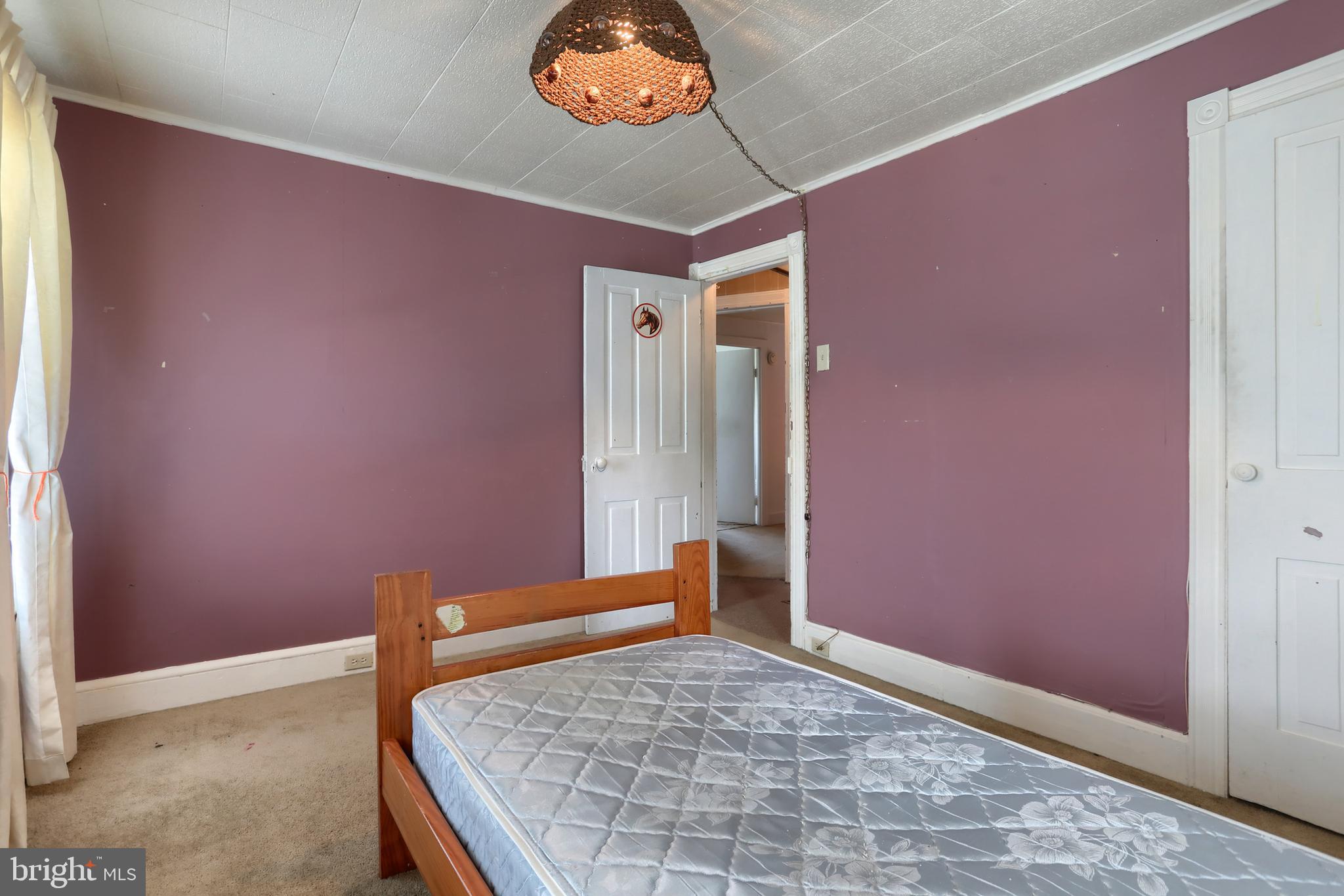 13 Montello Road Reading, PA 19608 - Photo 24 of 54 a bedroom with a bed and a chandelier