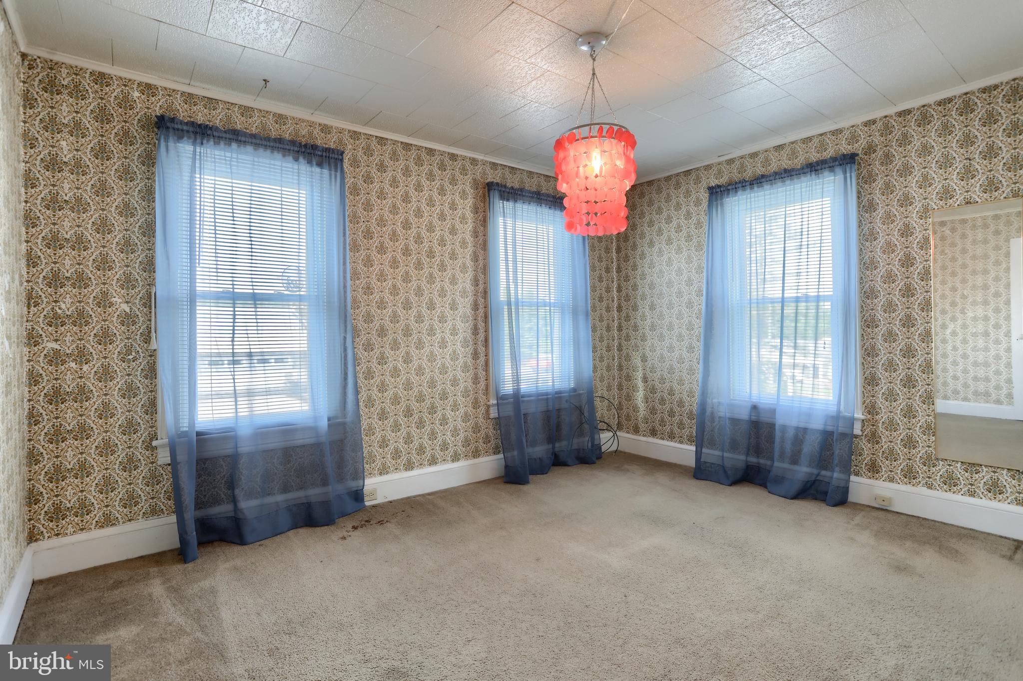 13 Montello Road Reading, PA 19608 - Photo 25 of 54 an empty room with windows and chandelier