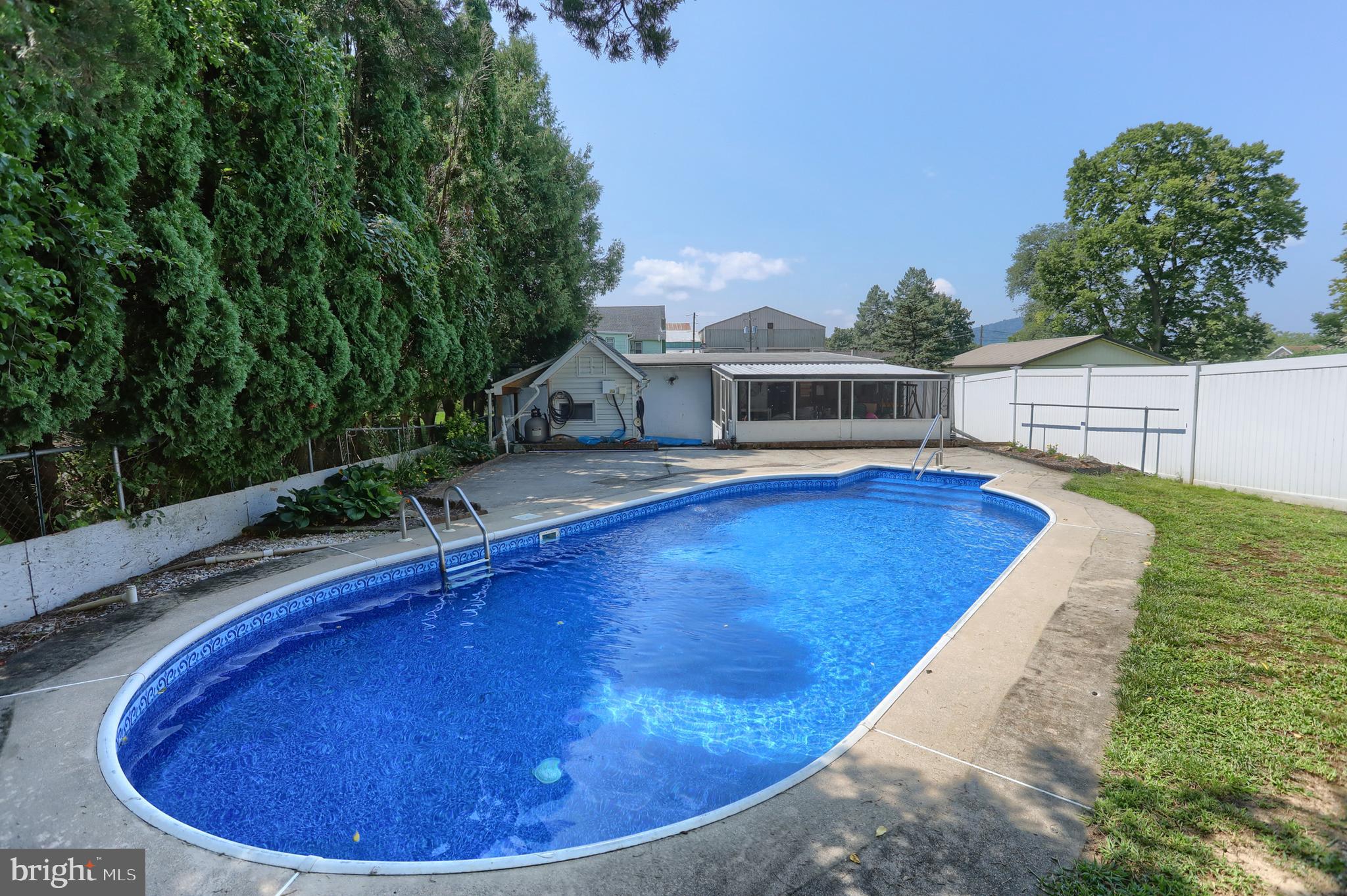 13 Montello Road Reading, PA 19608 - Photo 44 of 54 a view of a swimming pool with an outdoor seating