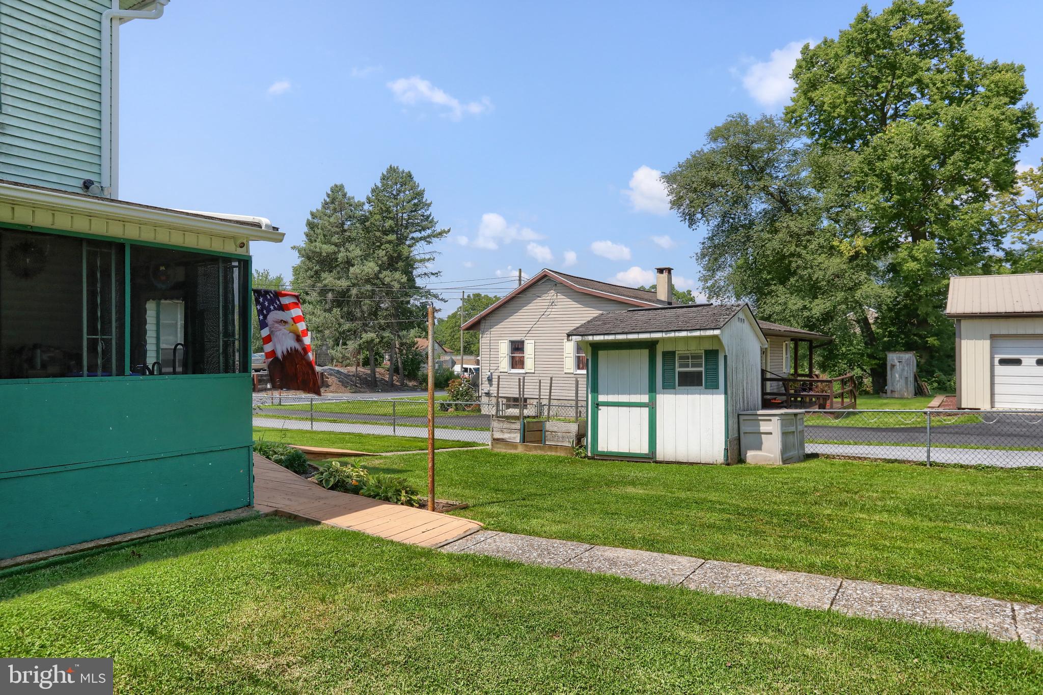 13 Montello Road Reading, PA 19608 - Photo 53 of 54 a front view of a house with a yard and trees