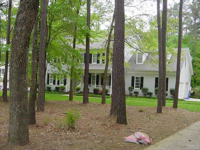 4713 Fallswood Place Raleigh, NC 27613 - Photo 1 of 1 a view of a white house with a big yard and palm trees