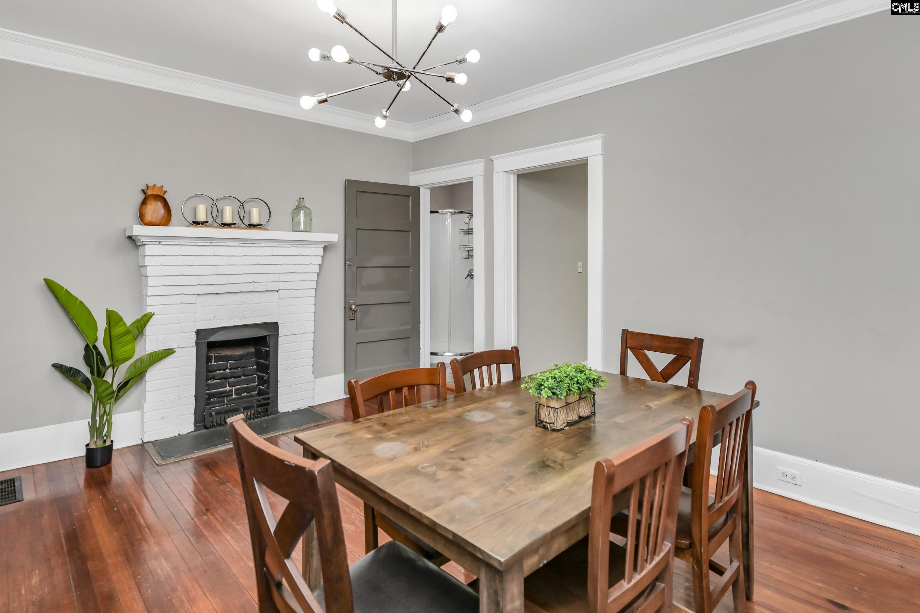 2227 Bull Street Columbia, SC 29201 - Photo 11 of 38 a view of a dining room with furniture and wooden floor