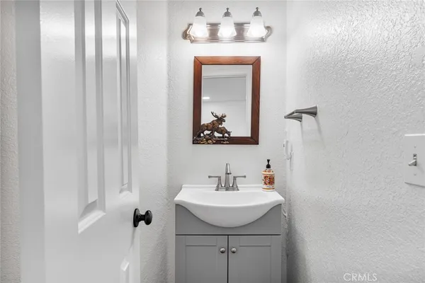 a bathroom with a sink and mirror
