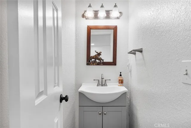 a bathroom with a sink and mirror