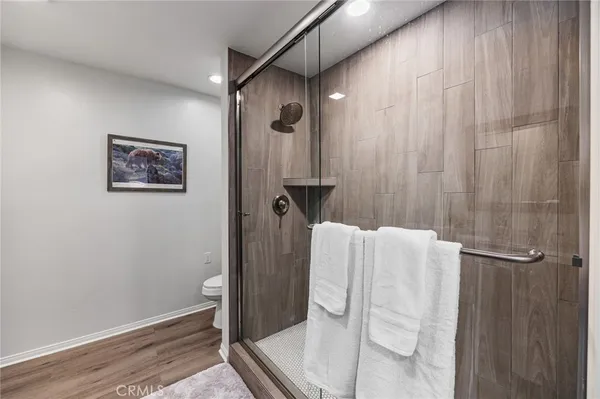 a bathroom with a shower and a shower