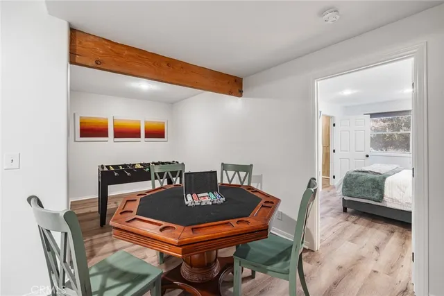 a dining room with a table and chairs