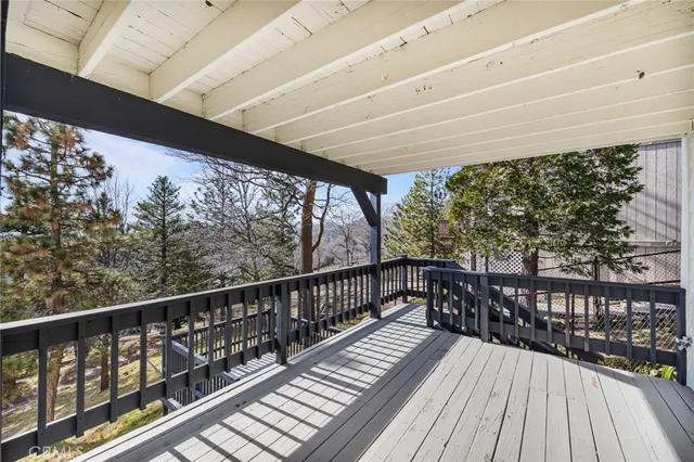 a view of balcony with wooden floor