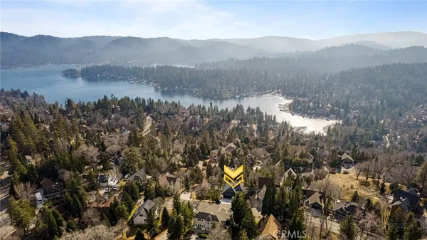 a view of a mountain in the distance in a field