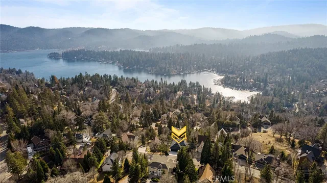 a view of a mountain in the distance in a field