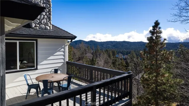 a view of a balcony with furniture