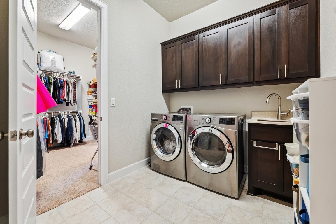 1005 Hezekiah Lane Leander, TX 78641 - Photo 23 of 36 a utility room with dryer and washer