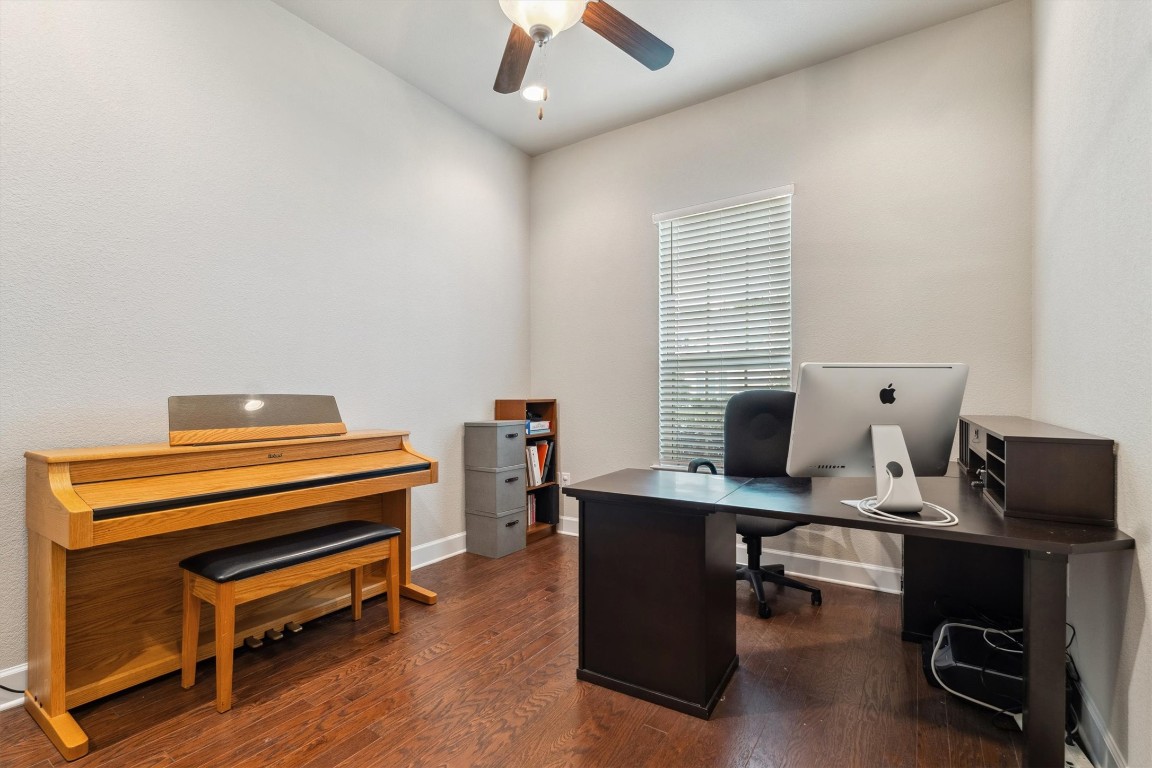 1005 Hezekiah Lane Leander, TX 78641 - Photo 24 of 36 a view of a workspace with furniture and a window