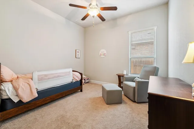 a bedroom with furniture and a window